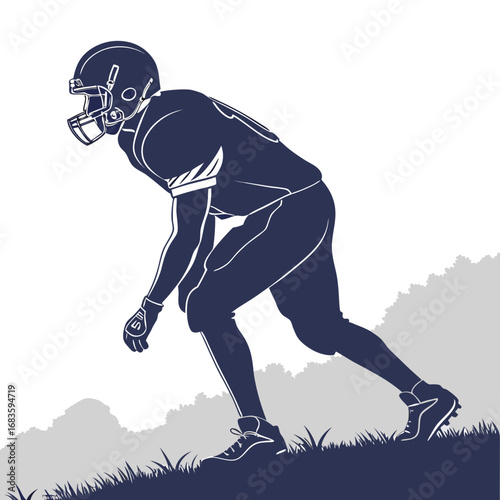 American football player in ready stance on grassy hill