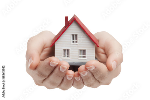 Miniature house held gently in cupped hands