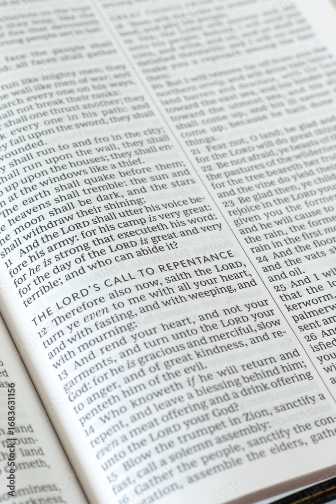 Obraz premium The LORD's call to repentance text in open holy bible book. Christian biblical concept of god's mercy and grace.