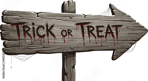 Spooky wooden sign with trick or treat message for halloween decorations art
