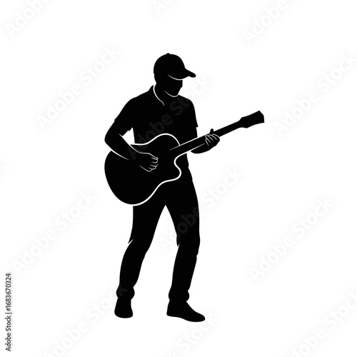 Silhouette of a man playing an acoustic guitar, showcasing musical performance and artistic expression.