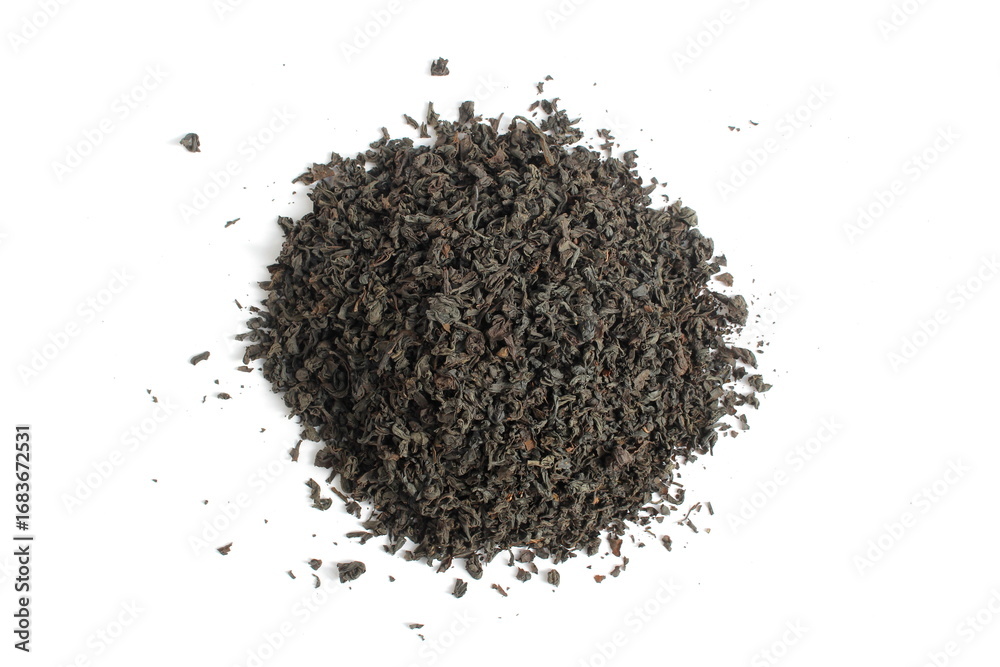 Dry tea leaves lie in a pile on a white background. Dry tea leaves lie in a pile on a white background.