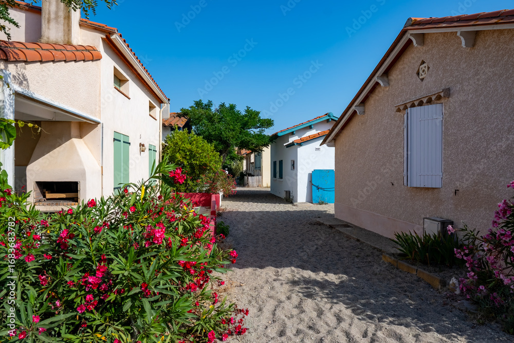 Fototapeta premium Le Racou hamlet houses in Argeles-sur-Mer, or the nook in Catalan, typical place along the Mediterranean coast, sandy paths, tourists destination near Collioure, France