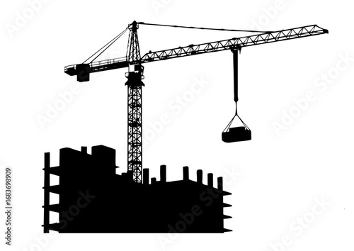 Construction Crane Lifting a Load Over Silhouetted Building Under Construction