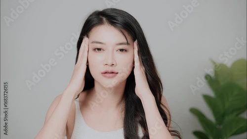 Beautiful woman applying skin lotion, beauty and skincare concept.