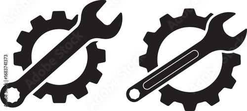 Two wrench and gear silhouettes isolated on white background