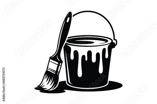 Paint bucket and brush dripping with paint
