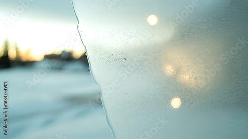 Abstract winter scene with soft sunlight reflected on a textured surface