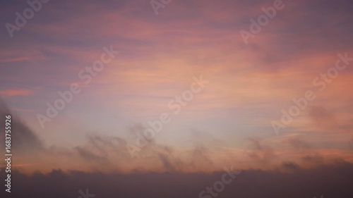 Low clouds flowing at sunrise time lapse