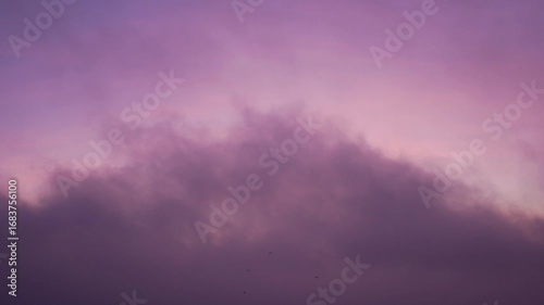 Low clouds moving at sunrise time lapse