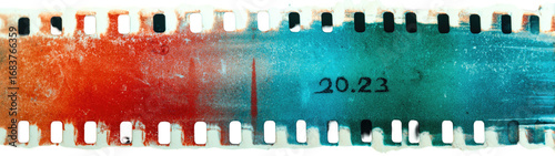 Old film strip with faded colors and date