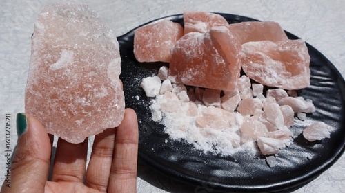 Blocks of Rock Salt in plate. Himalayan Rock salt unrefined with minerals beneficial for health and ayurvedic rituals