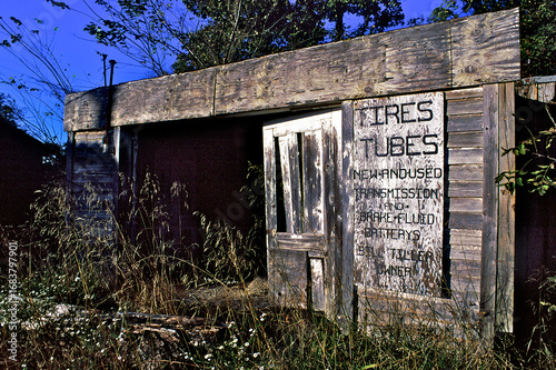 Old Wooden garage that serviced cars during the heyday of travel along Old Route 66 near Carthage, Missouri
