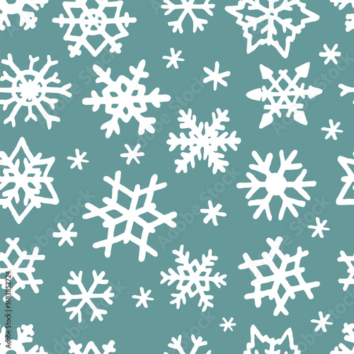 Vector seamless pattern with freehand drawn cartoon winter snowflakes snow made in kid childish style on cyan background