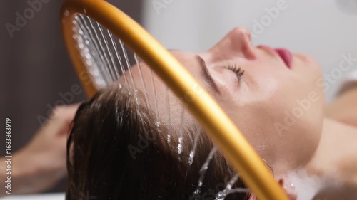 Woman receiving hydromassage treatment in a serene spa environment, enjoying aqua massage therapy with soothing water jets, promoting relaxation and rejuvenation for overall wellness experience