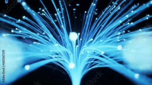 A vibrant display of blue fiber optic cables emanating from a central point on black background