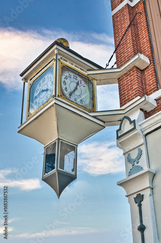 A clock in downtown Fostoria, on the  corner of the Foster Block building, in northwestern Ohio. USA 2025 