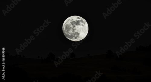 Full Moon Over Silhouetted Hills at Night