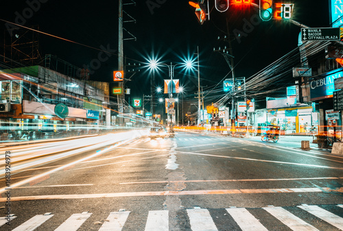 Nighttime Long Exposure Urban Intersection with Light Trails along Aguinaldo Highway, Imus, Cavite, Philippines