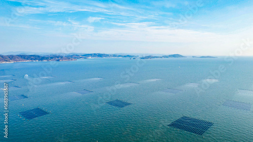 ドローン空撮による冬の瀬戸内海の牡蠣漁風景多島美（岡山県）/Oyster rafts in Seto Inland Sea, Okayama, Japan