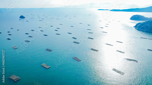 Photos ドローン空撮による冬の瀬戸内海の牡蠣漁風景多島美（岡山県）/Oyster rafts in Seto Inland Sea, Okayama, Japan