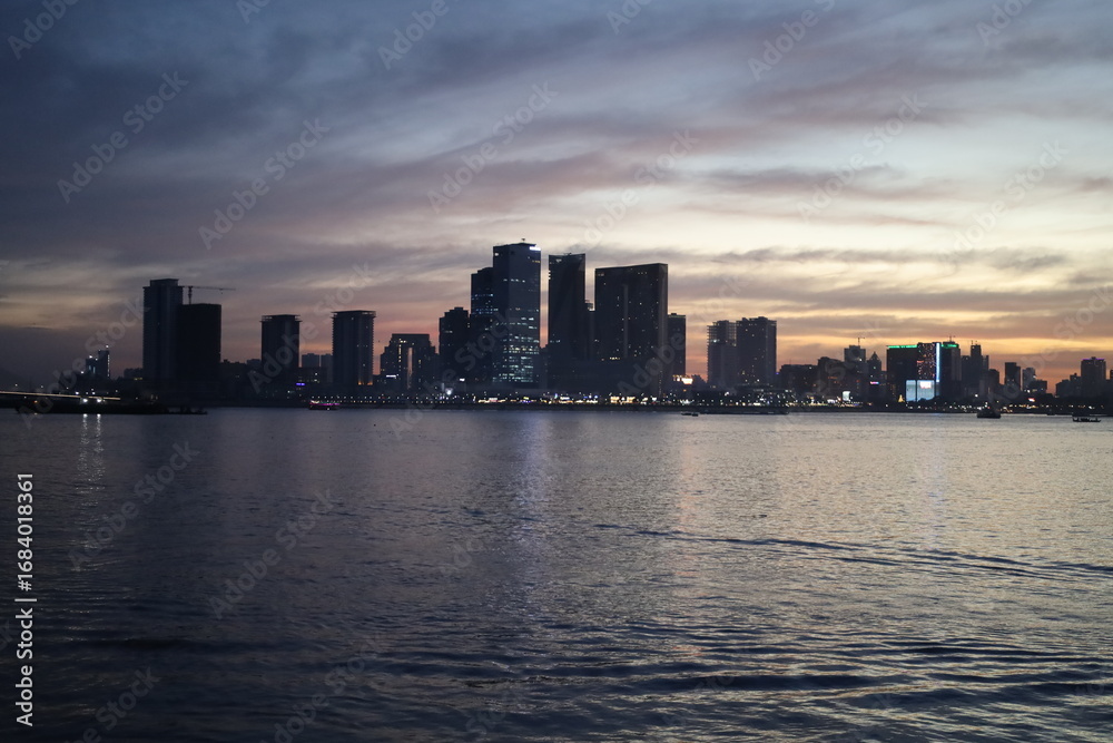 Fototapeta premium dusk view from the ferry in the river pretty lights phnom penh cambodia