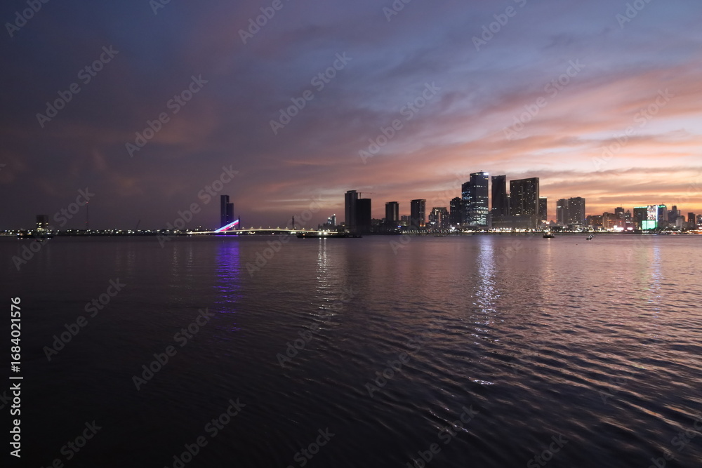 Fototapeta premium night time view from the ferry in the river pretty lights phnom penh cambodia