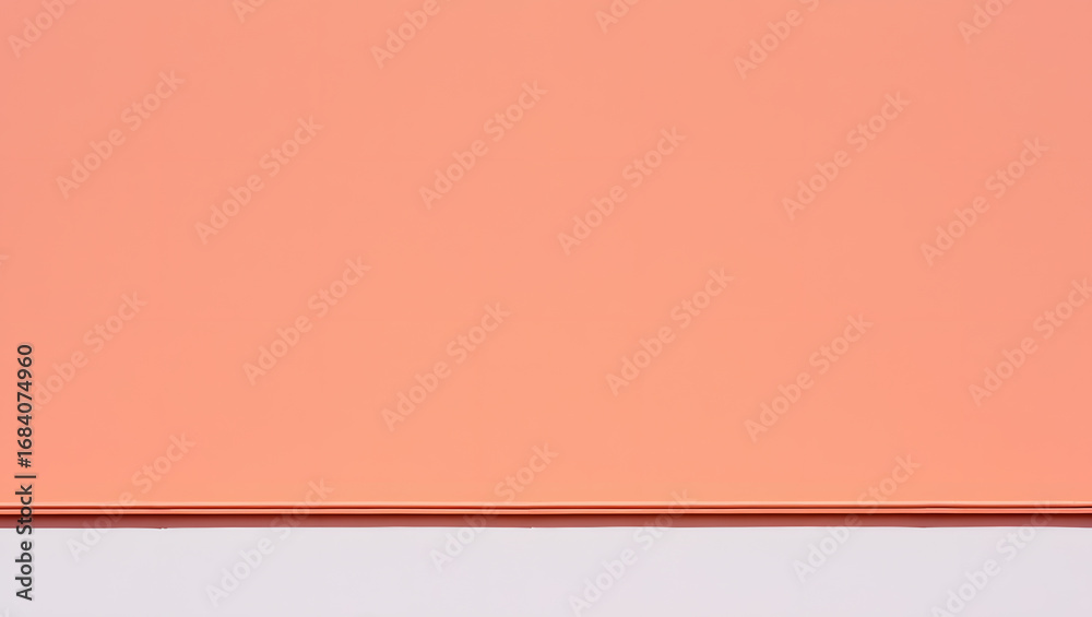Fototapeta premium A plain coral color background with a subtle texture, perfect for graphic design and presentations