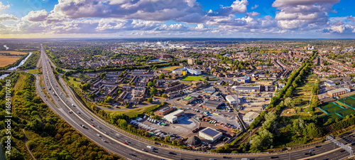 Aerial view of M4 motorway near Slough with houses, fields, and canal visible