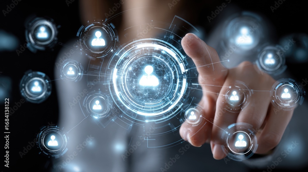 Fototapeta premium A person's hand interacts with a digital interface, showcasing futuristic elements like user icons and data connections, symbolizing technology and human connectivity in modern soc