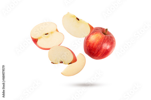 falling red apple with half and slice isolated on white background.