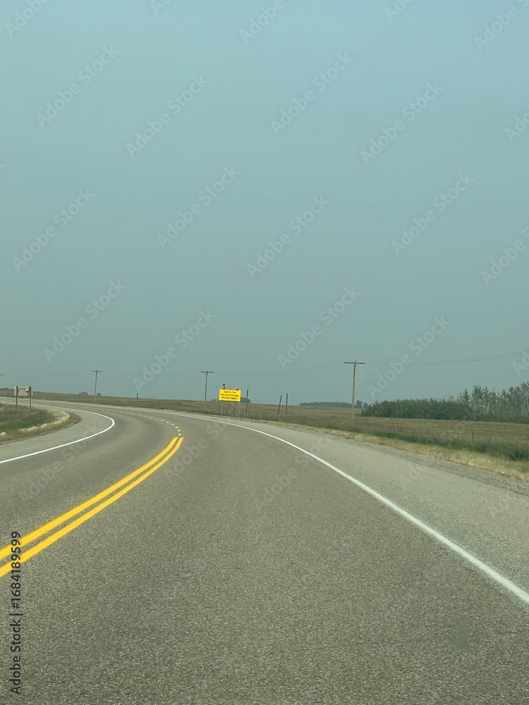 Fototapeta premium Driving down the highway on a asphalt pavement Road