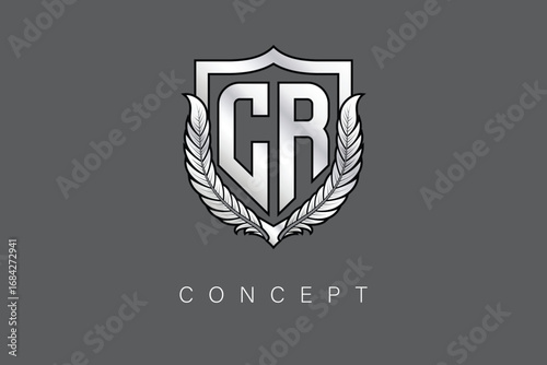 CR Creative Initial Letter Logo with Shield and Laurel Wreath Silver Metallic Branding Emblem on Gray Background.
