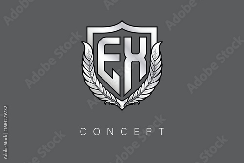 EX Creative Initial Letter Logo with Shield and Laurel Wreath Silver Metallic Branding Emblem on Gray Background.