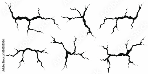 Collection of black cracked surface textures and grunge effects on white background
