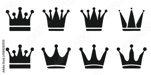 Collection of eight stylized black crown silhouettes on a black background