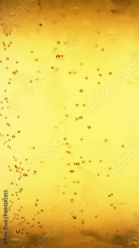 The bubbles from the beer indicate the fizziness.
