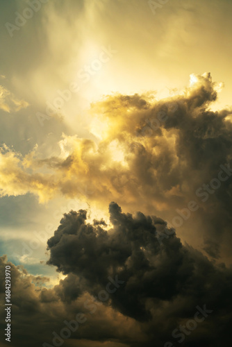 the dark clouds make the sky in black. The rain is coming soon.