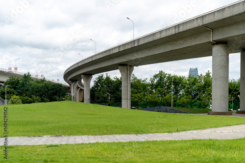 Concrete structure and asphalt road space under the overpass in the city