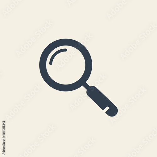Simple dark magnifying glass icon on a light beige background, representing search or zoom functionality.