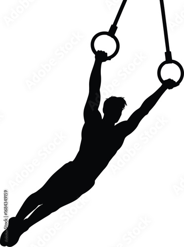 Male gymnast performing on rings gymnastics sport