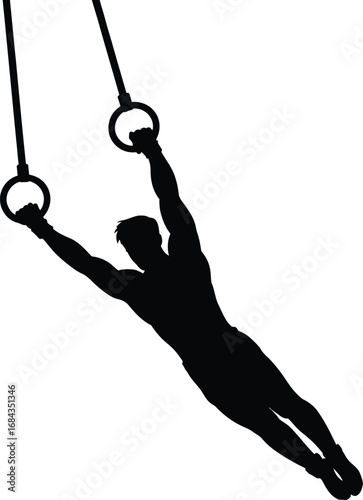 Male gymnast performing on rings gymnastics athletic
