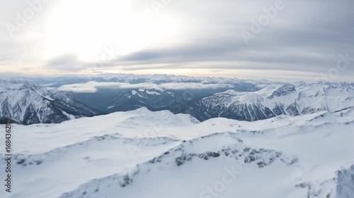 Wallpaper Mural Snowy mountain range landscape under a cloudy sky on a cold winter day. Torontodigital.ca