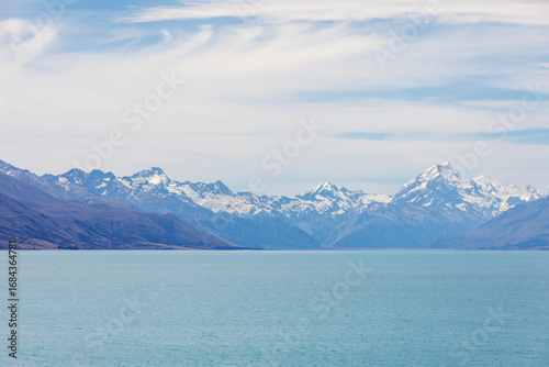 Wallpaper Mural Snowy mountains peaks across the lake with the cloudy sky, South Island, New Zealand Torontodigital.ca