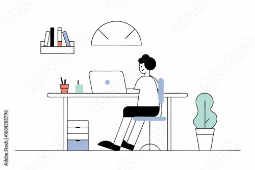 Focused professional working diligently on laptop at modern desk with organized supplies and books