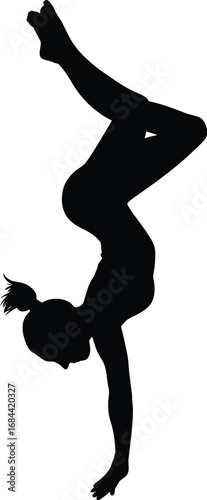 Silhouette of gymnast performing handstand athletic