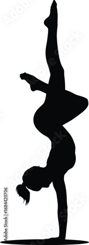 Silhouette of a gymnast performing a handstand gymnastics