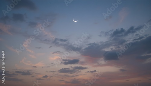 Crescent moon with colorful evening sky background for serene night designs
