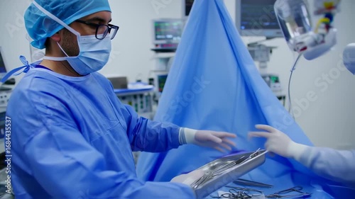 Surgeon preparing instruments