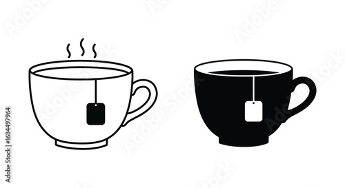 a steaming cup of tea next to a mug